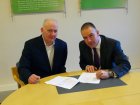 Jim Ashe - Ploughshare and Steve Rickard(right) – Qioptiq – sign the agreement